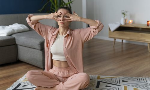 full-shot-woman-practicing-facial-yoga